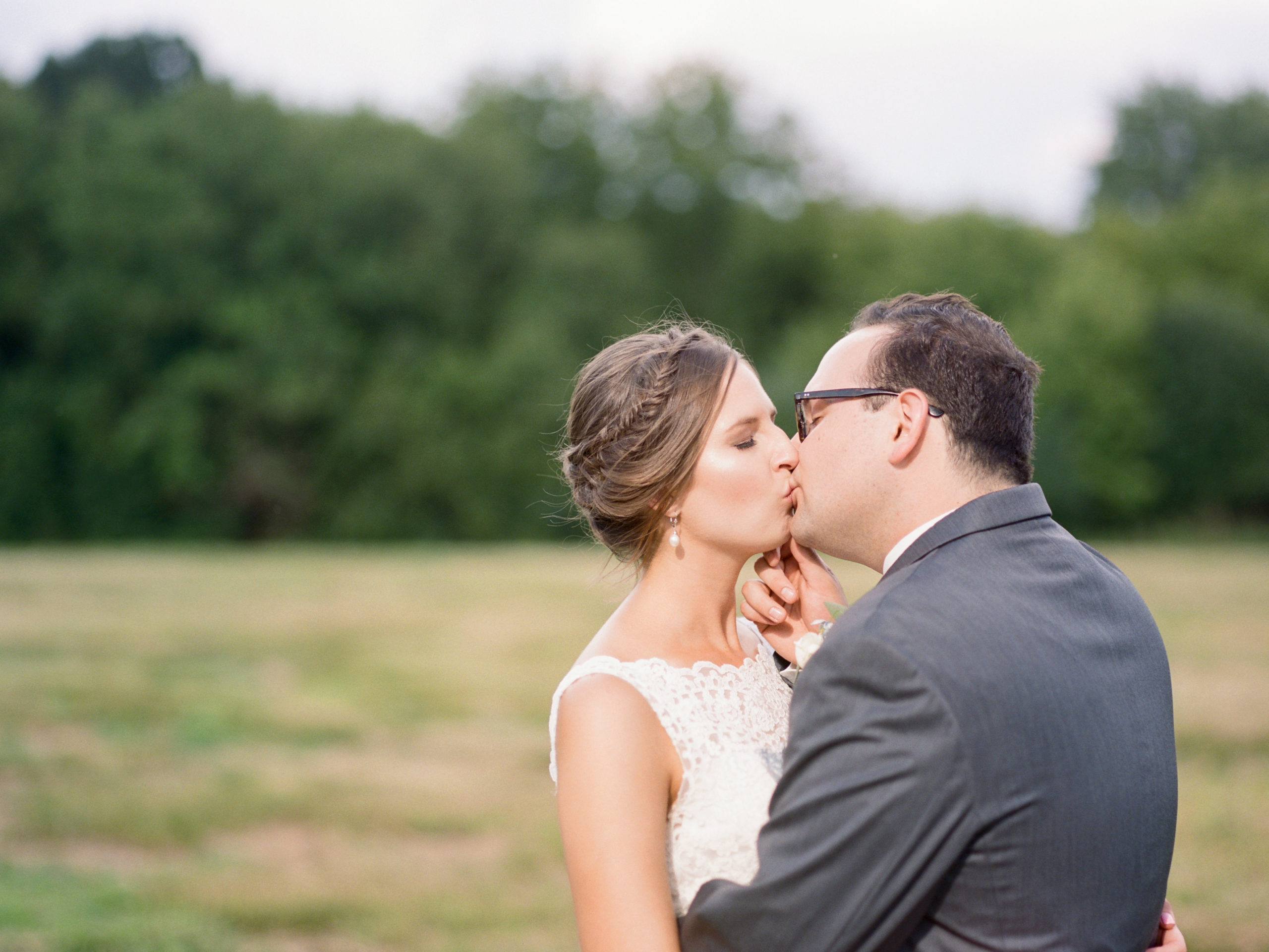 Wedding couple kisses after Green Acres Wedding