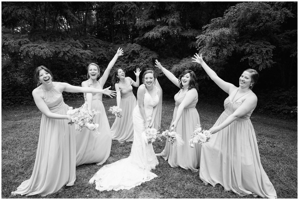 Bridal party joyful photo outside