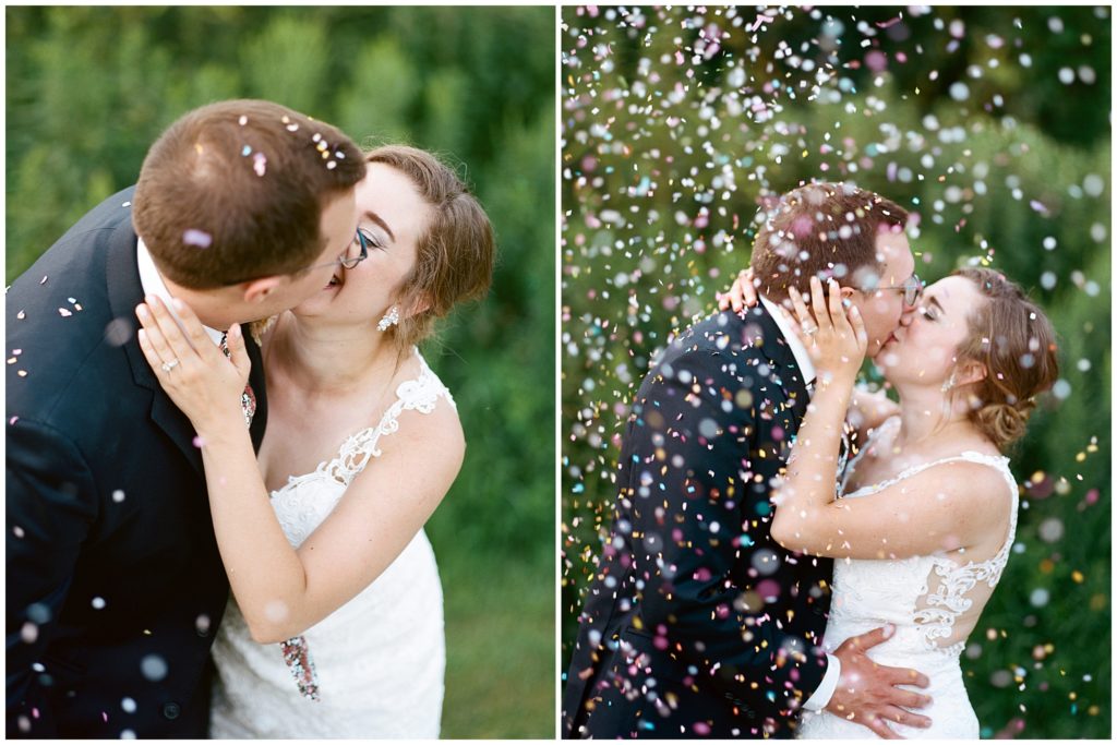 Couple kiss and embrace under pastel confetti outside Hope Glen Farm shot on medium format film and Portra 400