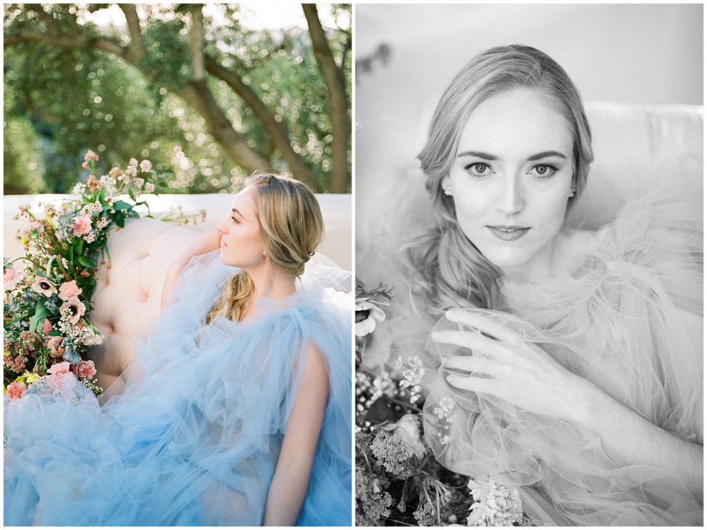 Close up portraits of bride wearing blue, Elizabeth Dye wedding gown, outside on pink couch, surrounded by orange and pink floral arrangement at Junipero Serra Museum