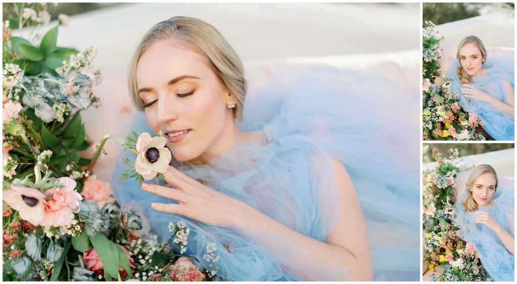 Close up portrait of bride in light blue wedding dress, surrounded by colorful flowers by Oak and the Owl in California