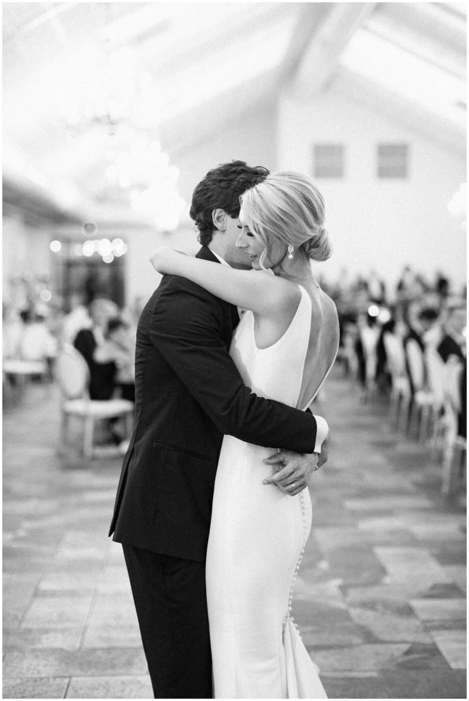 Bride and groom hug after their first dance at Edward Anne Estate