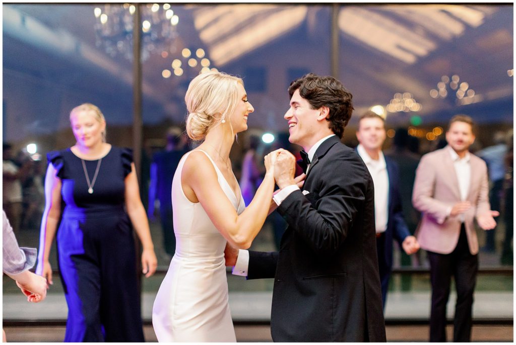 Wedding couple dances during reception party at Bavaria Downs in Minnesota