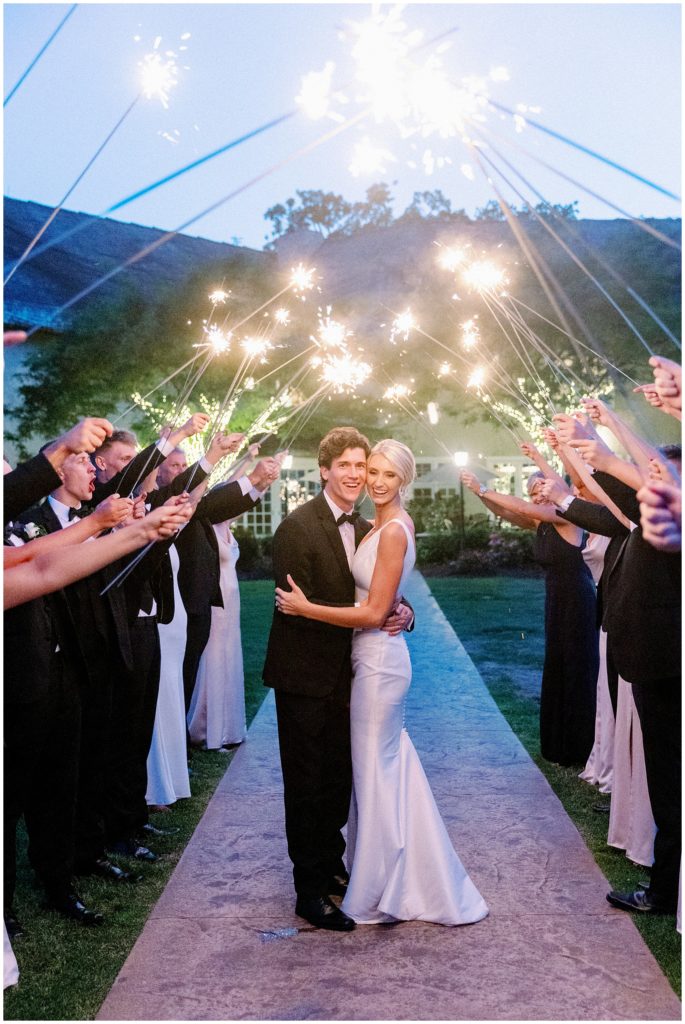 Bride and groom smile at their sparkler exit at Edward Anne Estate by Bavaria Downs wedding by The Byes Photo